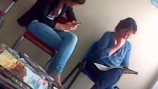 Candid dangling in waiting room