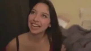 Asian babe in a red dress gives a blowjob