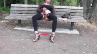 Lovely crossdresser jerks it on a park bench