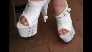 Footplay in white studded platform mules