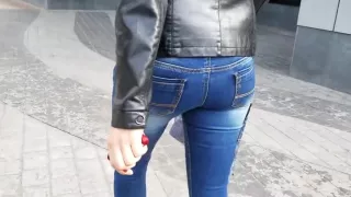 Sexy girl with round ass in leather jacket