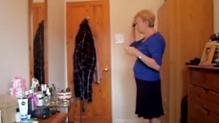 Wearing a blue skirt and flashing her tits