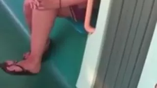 Candid feet in flip flops legs face on train
