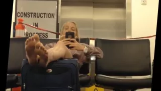 Blond spying feet in airport sexy