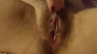 Horny hairy wife pleases her very wet pussy