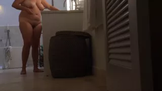 Voyeur hidden cam unaware milf in bathroom