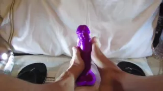 Sucking foot job and riding my huge purple dildo