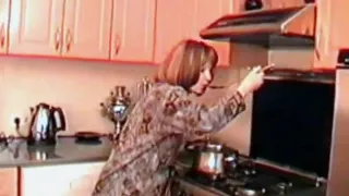 Mom angela with her boy in kitchen.