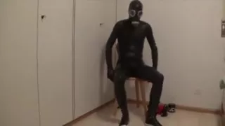 Black latex catsuit play