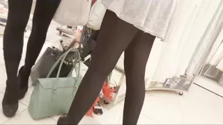 Sexy girl in mini skirt and black pantyhose upskirt