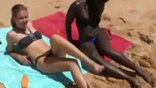 African Ebony and Blonde share a white cock on the beach BWC