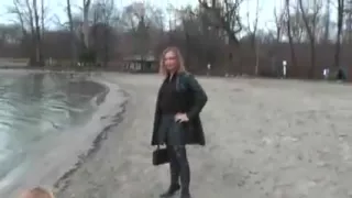 Leather slut with buttplug outside