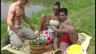 Hot girl takes care of two guys outdoors