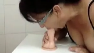 Takes out her big mature tits while sitting on thick dildo