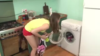 Hairy milf masturbating on a washing machine