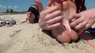 Blindfolded and tickled on the beach