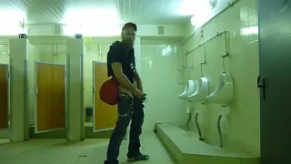 Guy stroke in public toilet