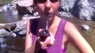 Beautiful girl smoking her pipe