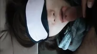 Blindfolded girlfriend sucking a cock