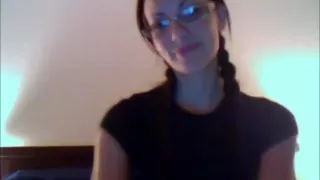 Redhead in Glasses fucks vibrator