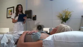 Horny nurse shoves a toy in blonde patient's pussy