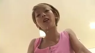 beautiful Japanese girl spitting on the table