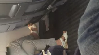 German candid shoe dangle in train
