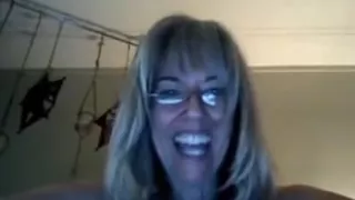 MILF plays with showerhead while standing