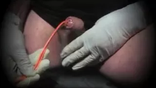 Gay sounding the penis with a round arch folds