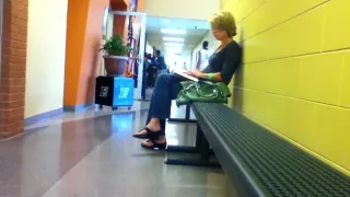 Woman dangling sandals 1