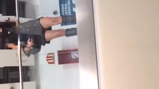 Standing next to the barander with no panties. Upskirt flash