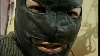 Bondage act with a tranny and chap in mask