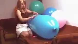 Riding a blue zeppelin shaped balloon till pop