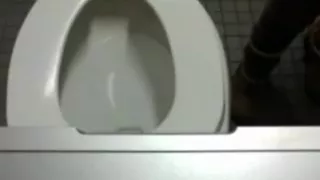 Big titty babe dildos her pussy in public bathroom