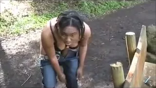 Hot Ebony Woman takes a bath in the woods