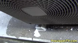 Hot japanese babe pisses in public alley