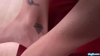 Amazing asian girl fucks her twat with her fingers on a red couch