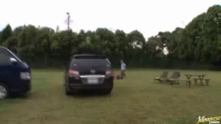 Pretty and skinny Asian babe making out and blowing two hard cocks outdoors