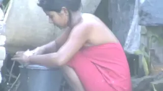 wow... outstanding desi village gal bathing outside
