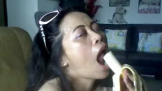 Thai Older Lady Showing Her Large Love Bubbles And Engulfing Banana