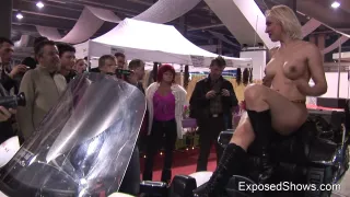 Breathtaking breasty cutie posing on the bike