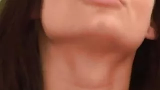 Young slender brunette with a glass dildo