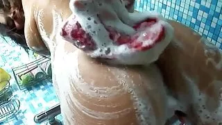 Girl Massages her Suds Covered Tits Before Creaming