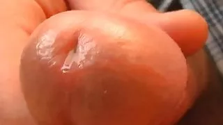 Nice long closeup of precum, natures lube.
