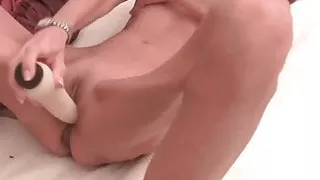 Scrawny grandma fucks herself with a big dildo