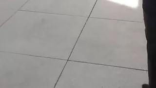 woman trying Thigh High Boots in public