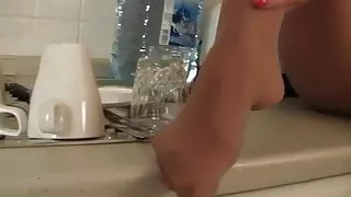 Long Legs In Pantyhose On The Kitchen Counter