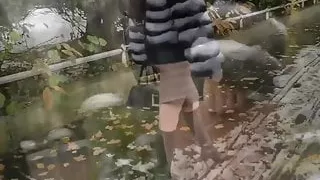 Hooker waiting in louboutin boots in street