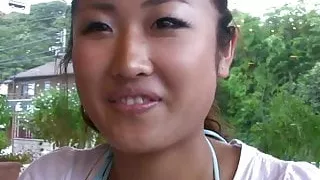 Cute girl is eating her breakfast smiling