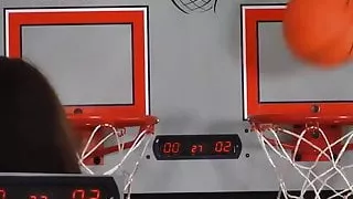 Two adorable girls play a game of strip basketball shootout